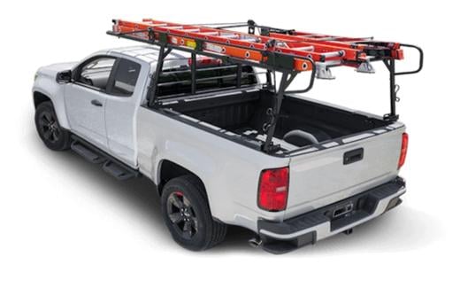 White pickup truck with over bed storage rack with ladders on it