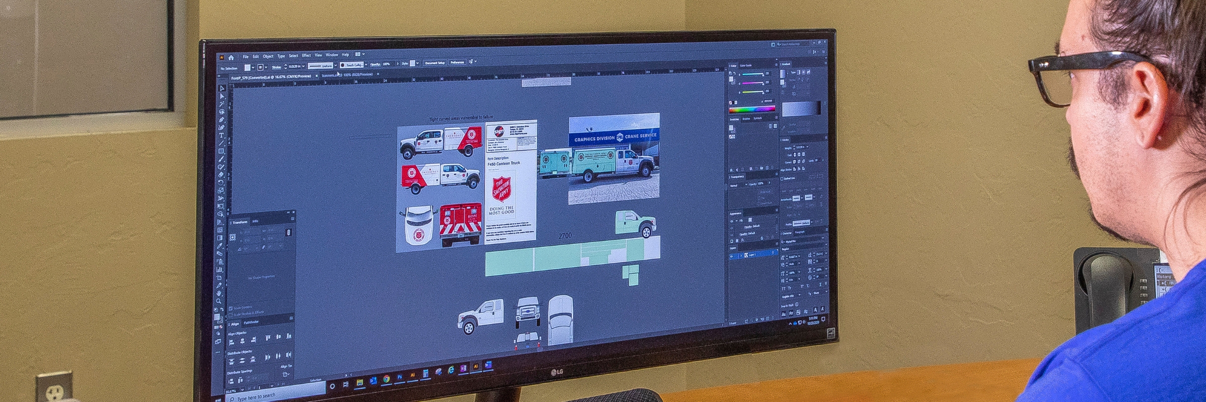 employee designing vehicle graphics on computer